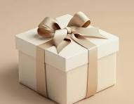 Cream gift box tied with a linen ribbon bow on a beige background, used for the add-a-gift-message option