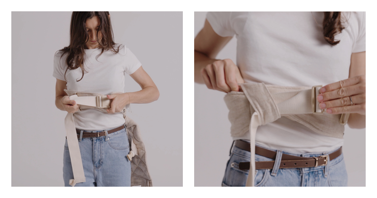 Close look at clipping and tightening the side-release buckle on the Daily baby carrier waist belt