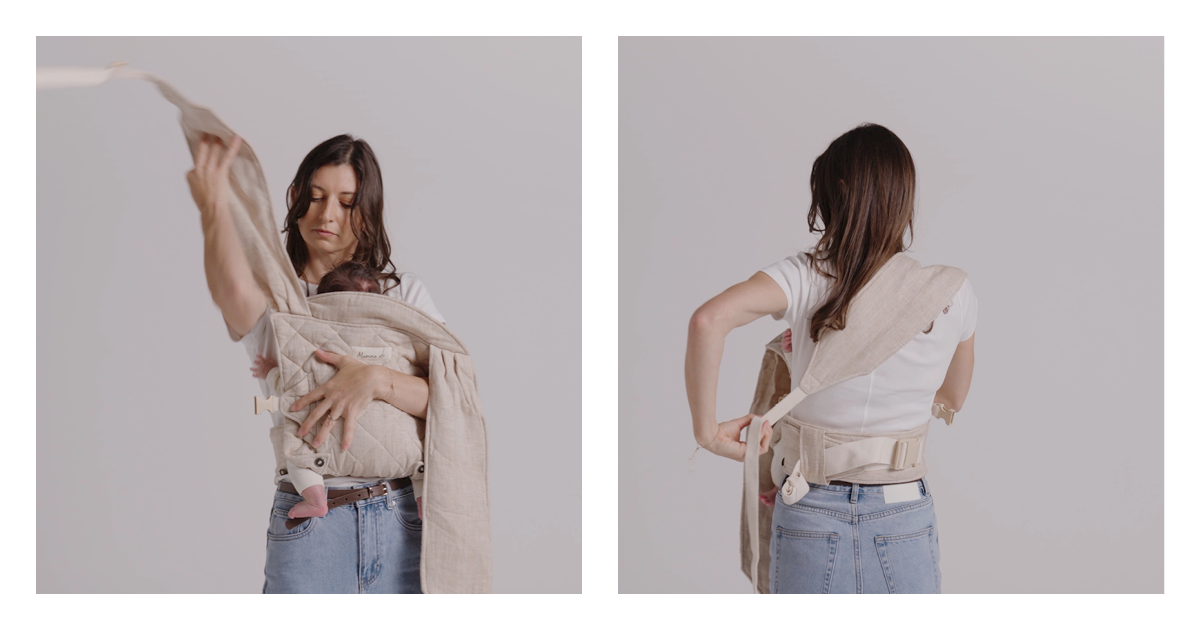 Mum bringing the first Daily baby carrier strap over her shoulder, then reaching behind to secure it across her back