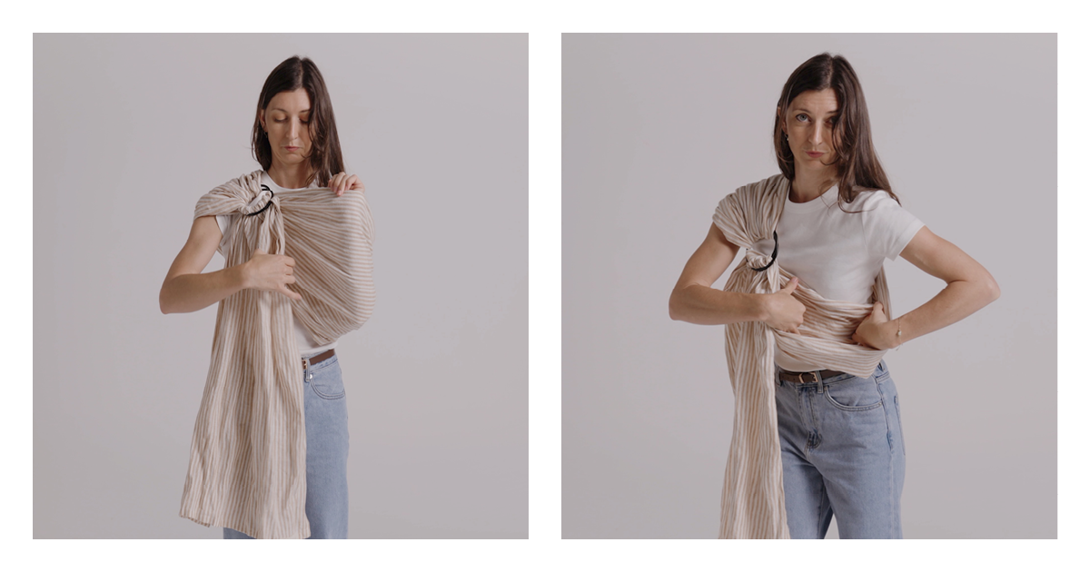 Mum spreading the striped linen sling fabric into an open pouch across her body, rings sitting at her shoulder