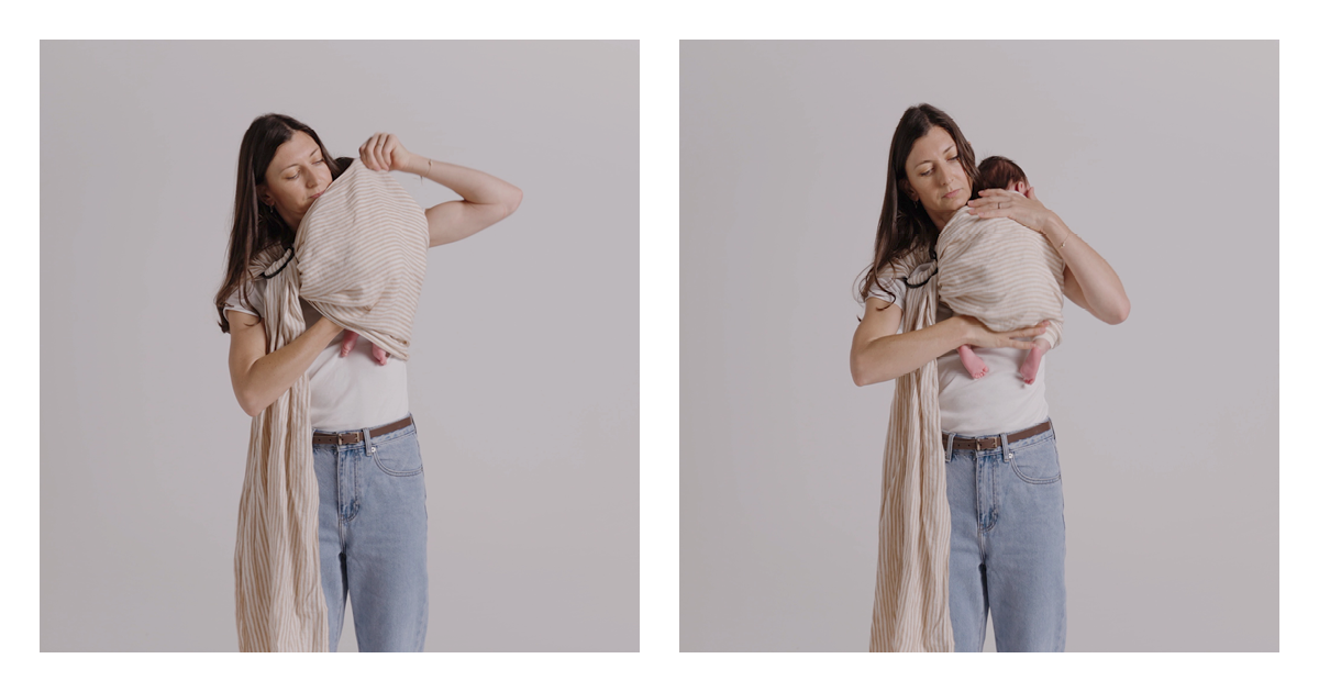 Mum drawing the sling fabric up over her newborn's back and across to her shoulder