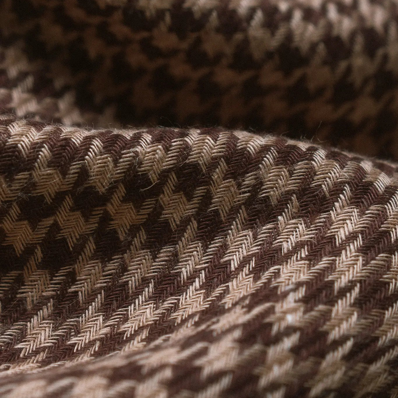 The Arista houndstooth Daily carrier laid flat on a hanger, reshaped and ready to air dry in the shade